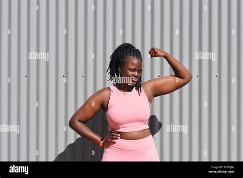 Black Woman Flexing Biceps Hi Res Stock Photography And Images Alamy