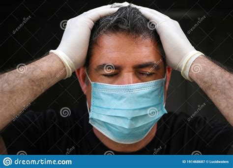 Upset Man Wearing A Face Mask Holding Her Head Stock Image Image Of Adult Closed 191468687