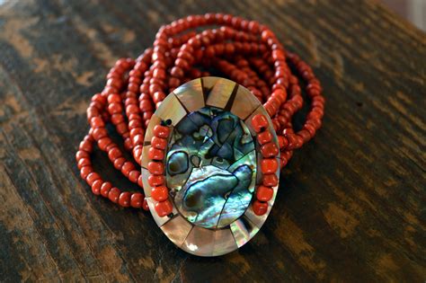 We make fashion with wit, heart and conscience. Red Abalone Shell and Mother of Pearl Bracelet - Bali Mantra