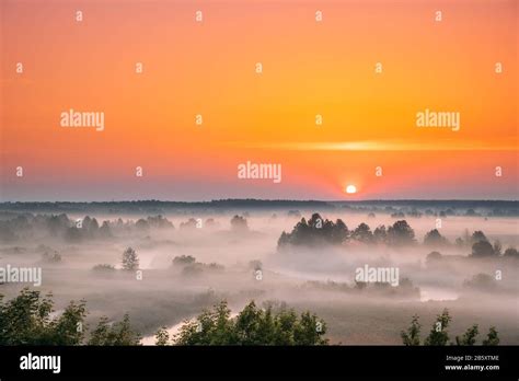 Amazing Sunrise Sunset Over Misty Landscape Scenic View Of Foggy