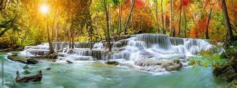 Colorful Majestic Waterfall In National Park Forest During Autumn