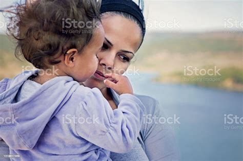 Portrait Of Sad Mother Hugging Her Daughter Stock Photo Download