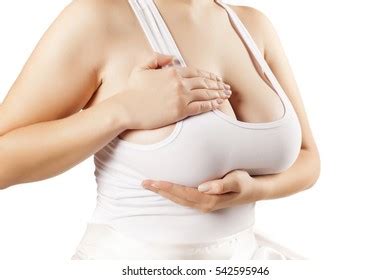 Woman Touching Her Breasts Through Shirt Shutterstock