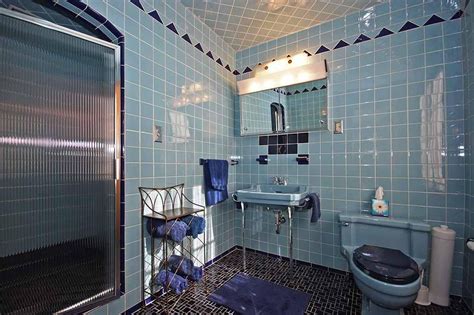 Retro bathroom tile can actually look cool—here's how. blue tile retro bathroom | Retro bathrooms, Vintage ...