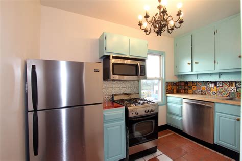The wall cladding came from a salvage yard; Rockaway Kitchen - Mediterranean - Kitchen - New York - by Reclaimed Home