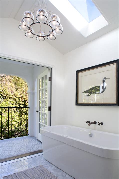 white modern master bathroom  skylight  balcony hgtv