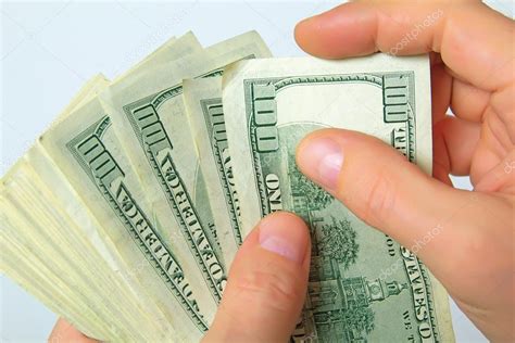 Cash Us Dollars In Hand Stock Photo By ©rrraum 104176570