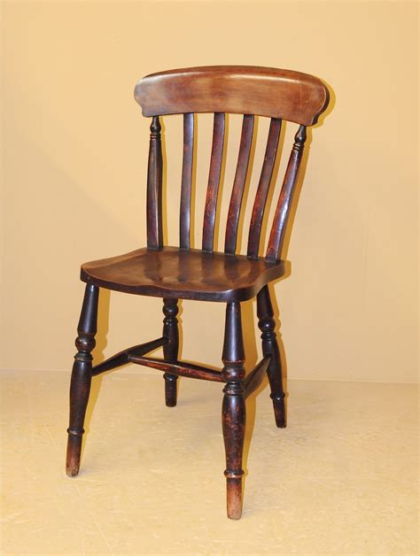 The traditionally retro table and chairs in the middle are a bright white, grounding the eclectic space in neutrals. 6 Farmhouse Kitchen Chairs - R3539 - Antiques Atlas