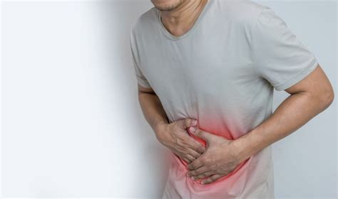 Premium Photo Man Suffering From Stomach Ache With Both Palm Around