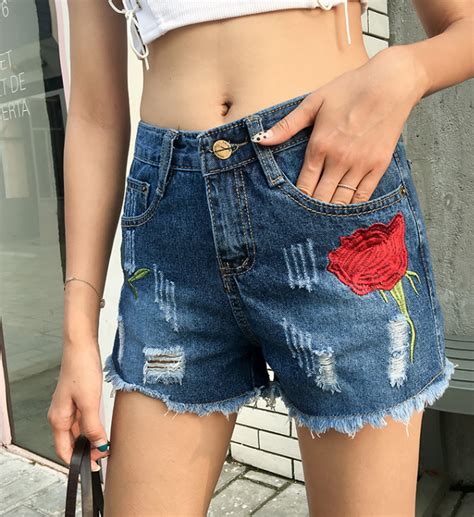 rose embroidered ripped denim shorts on storenvy