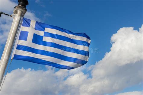 Waving Greek Flag On A Sunny Day Against The Sky Stock Image Image Of