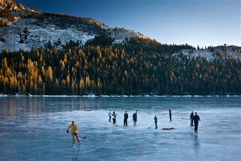 People Ice Skating On Frozen Lake Hd Wallpaper Wallpaper Flare