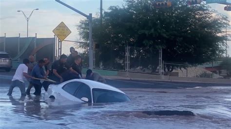 Woman Rescued From Car Moments Before Its Swallowed By A Sinkhole