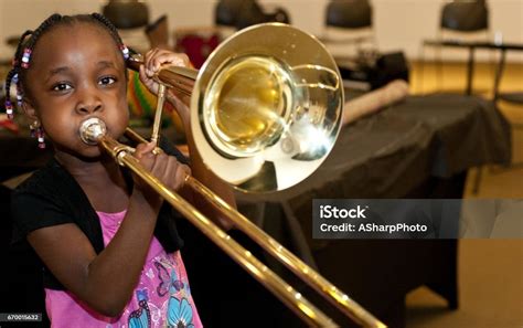 Black Girl Playing A Trombone Stock Photo Download Image Now Child