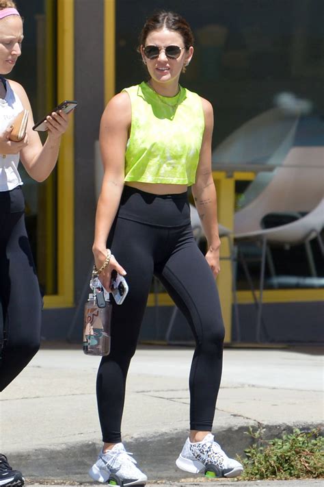 Lucy Hale Sports A Green Tie Dye Crop Top And Black Leggings While