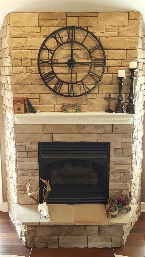 Whether you want to use one to frame an electric fire or gas fire, a stone fire surround offers an array of options to suit your decor.our limestone fireplaces are a fantastic option, whether you want a traditional period fireplace or something modern and chic. Stone fireplace with clock | Fireplace mantel decor ...