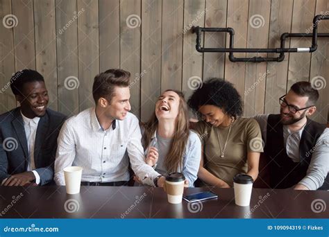 Caucasian Man Joking At Cafe Meeting Making Multiracial Friends Stock