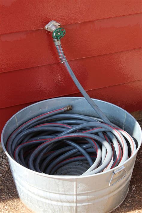 16 Creative Ways To Transform Your Home And Backyard With Stock Tanks Garden Hose Storage
