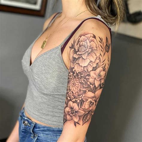 a woman with a flower tattoo on her arm