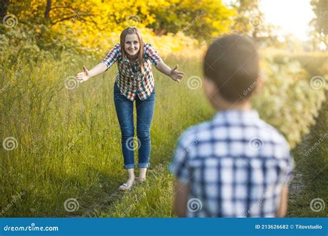 Son Gives Mom A Bouquet Of Wildflowers Stock Photo Image Of Summer