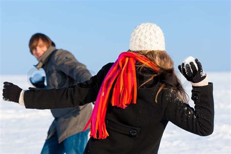 Couple Having Snowball Fight Stock Image Colourbox