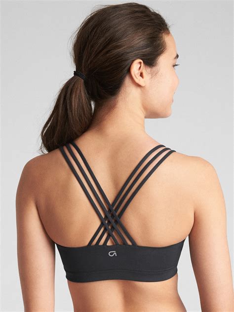 No flaws bra has subtle stat pattern adjustable band width. GapFit Eclipse Medium Support Strappy Sports Bra | Gap