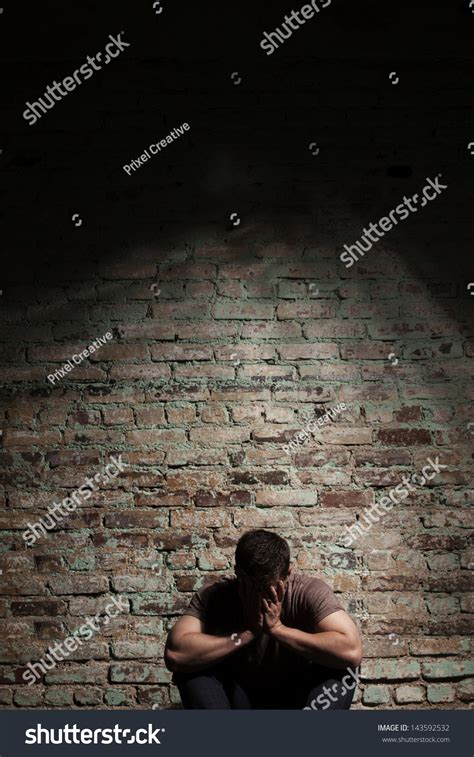 Sad Man Sitting Alone Against Brick Stock Photo 143592532 Shutterstock
