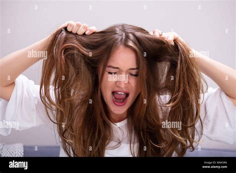 Pulling Hair Out Hi Res Stock Photography And Images Alamy