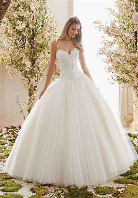 This whimsical dress has a full tulle skirt with the lace. Chantilly Lace on Tulle Ball Gown Wedding Dress | Morilee