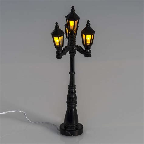 Maybe you would like to learn more about one of these? Battery powered street lamp with 4 lights, H11cm | online ...