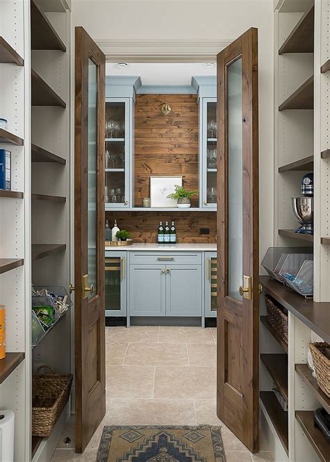 Pantry With Double Doors Open Directly To Butlers Pantry And Kitchen