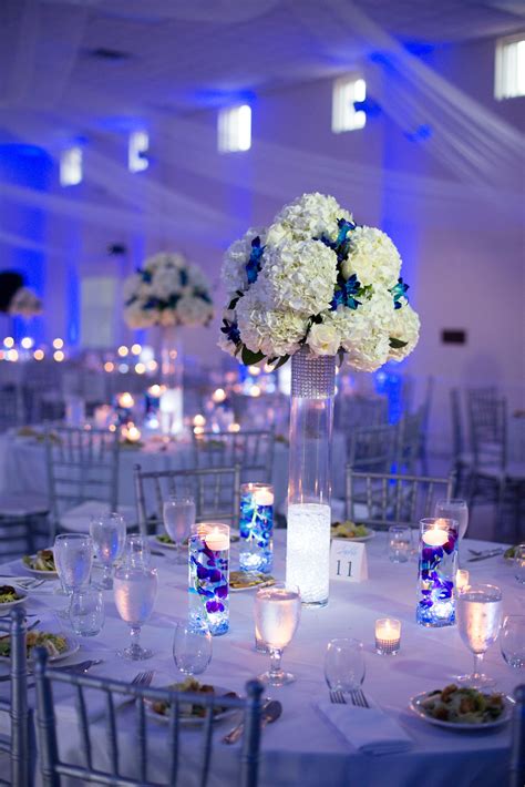 White and Silver Reception Decor with Blue Uplighting