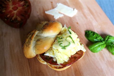 egg cheese and tomato sandwich on a homemade kaiser roll epicure s table