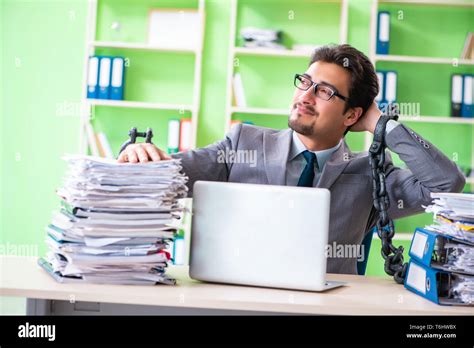 Employee Chained To His Desk Due To Workload Stock Photo Alamy