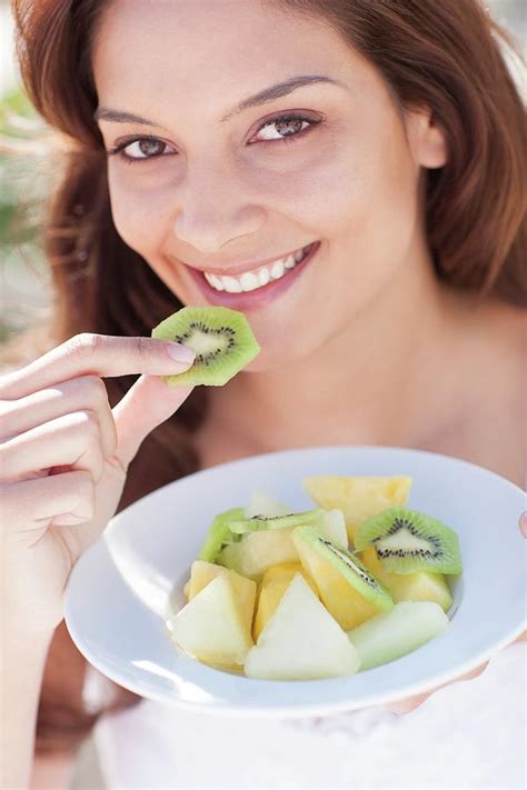 Woman Eating Fruit Photograph By Ian Hooton Science Photo Library Fine Art America