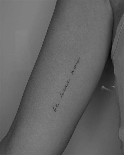 A Woman S Arm With The Word Love Written In Cursive Writing On It