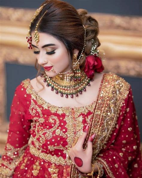 red and gold bridal outfit pakistani bridal makeup
