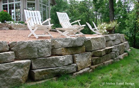 They are made by carefully stacked and chelated basalt rock to form a beautiful and natural rock retaining wall. Natural stone outcropping retaining wall | Landscape walls ...