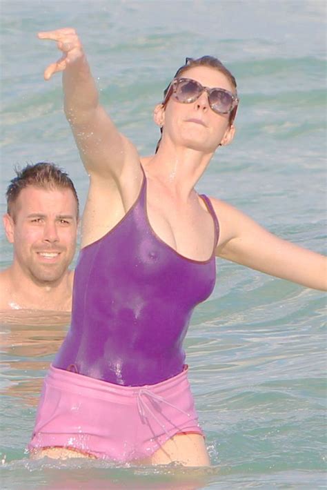 anne hathaway nipples in see thru wet swimsuit at beach in miami see through clothes