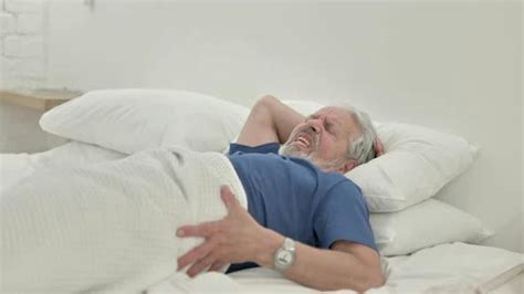 Old Man Waking Up In Bed With Spinal Back Pain Stock Footage Videohive