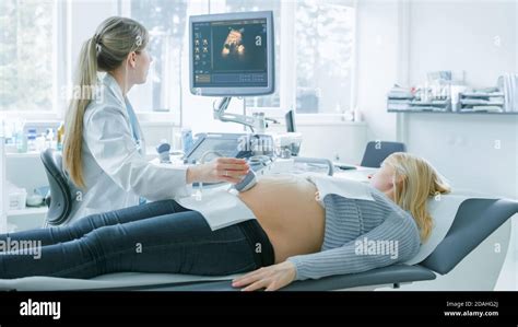 In The Hospital Pregnant Woman Getting Ultrasound Screening Obstetrician Checks Picture Of The