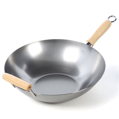 To remove rust, use a good amount of soap and scrub it with steel wool one area at a time until it's all clean. Carbon Steel Wok | Wayfair