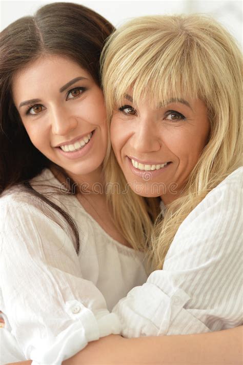 Mother And Daughter Smiling Stock Image Image Of Efficient Beauty 83549557