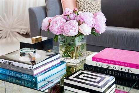 If your new homeowners are into music, there's a. Styled Mirrored Cocktail Table with Designer Coffee Table Books - Contemporary - Living Room