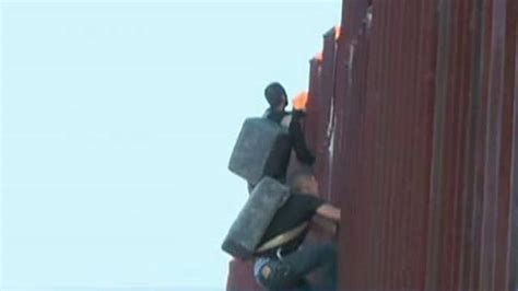 Two Suspected Drug Smugglers Caught Climbing Fence Into Us Latest News