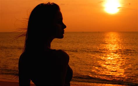 Silhouette Of Woman At Sunset