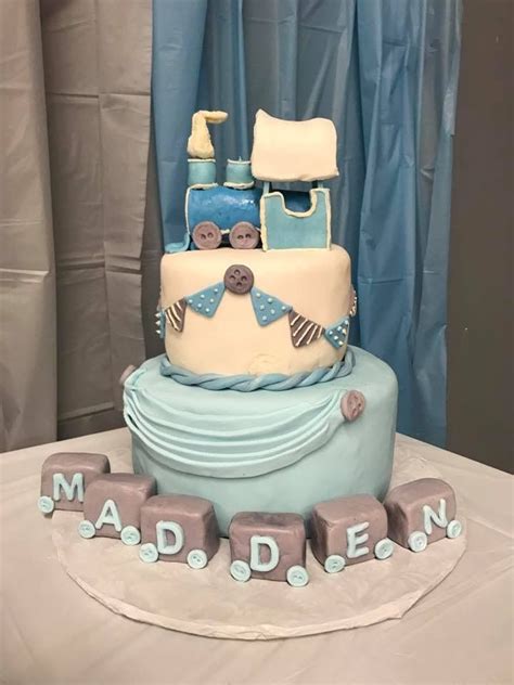 A Blue And White Cake Sitting On Top Of A Table