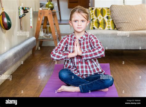 6 Year Old Girl Practice Relaxation Exercises Stock Photo Alamy