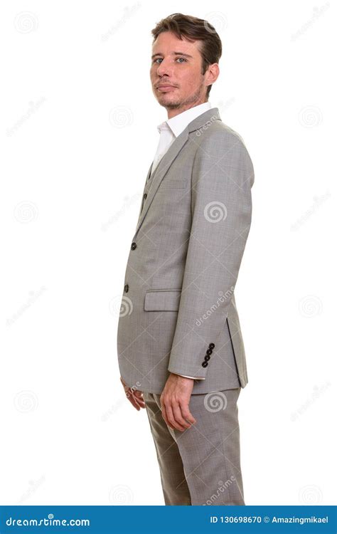 Side View Of Handsome Caucasian Businessman Looking At Camera Stock
