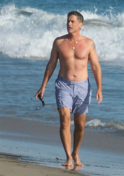 shirtless rob lowe 56 looks half his age as he hits the beach in swim trunks the us sun
